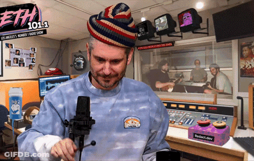 Man At Microphone In Front Of ETH 101.1 Sign GIF