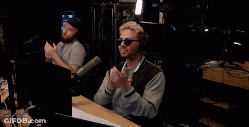 Man At Microphone In Front Of The Podcast Sign GIF