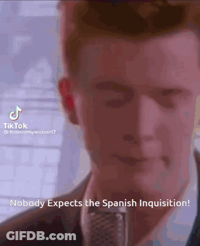 Man At Microphone: Nobody Expects The Spanish Inquisition GIF