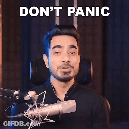 Man At Microphone Saying Don't Panic GIF