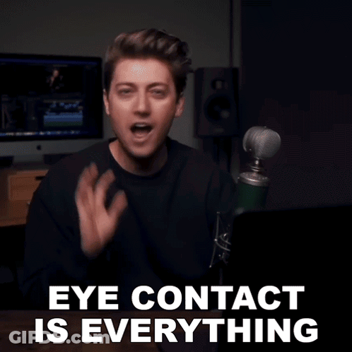 Man At Microphone Saying Eye Contact Is Everything GIF