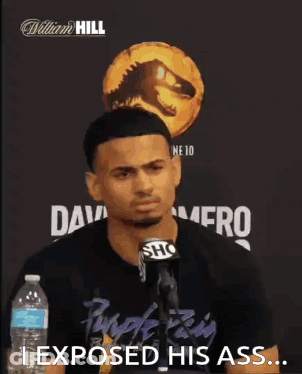 Man At Microphone Saying I Exposed His Ass GIF