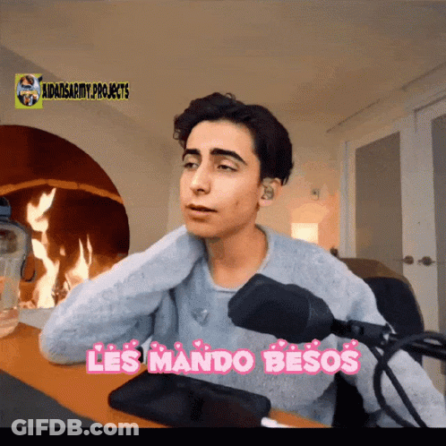Man At Microphone Saying Les Mando Besos GIF