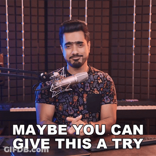 Man At Microphone Saying Maybe You Can Give This A Try GIF