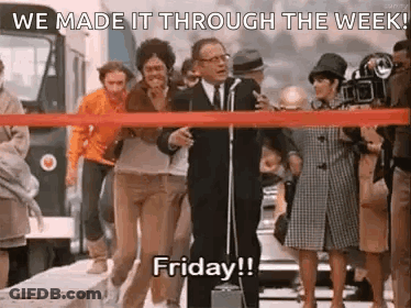 Man At Microphone Says We Made It Through The Week GIF