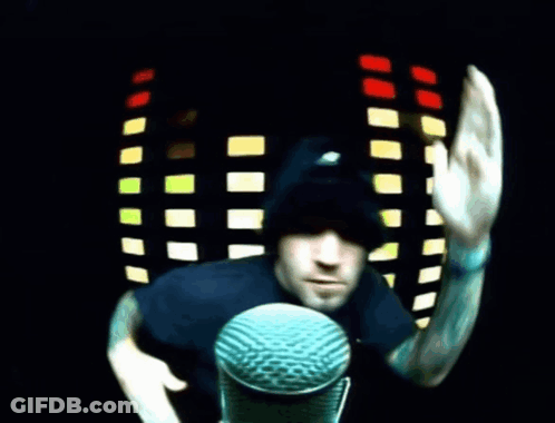 Man At Microphone Waving GIF