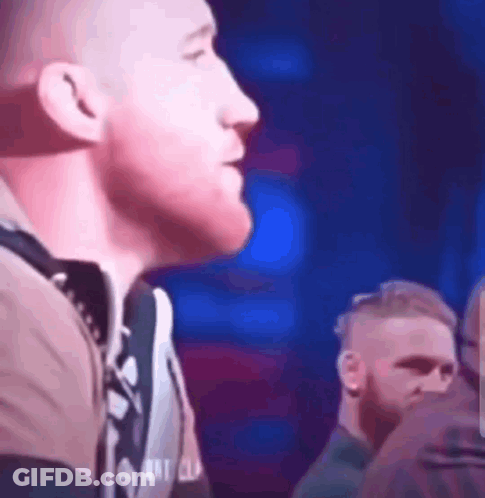 Man At Microphone With Blue Light GIF