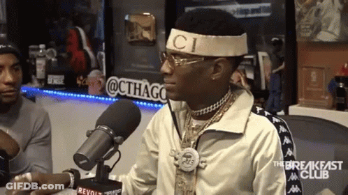 Man At Microphone With C Headband GIF