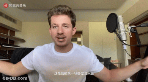 Man At Microphone With Chinese Writing GIF