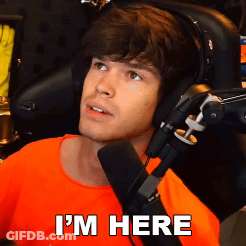 Man At Microphone With I'm Here Below GIF