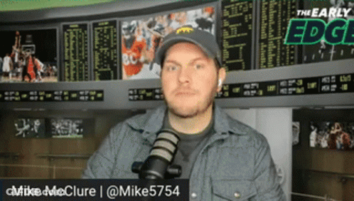 Man At Microphone With Name Mike McClure GIF