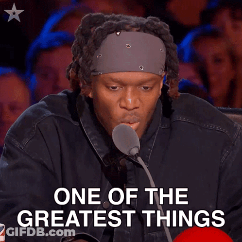 Man At Microphone With One Of The Greatest Things Above Him GIF