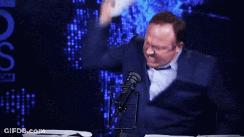 Man At Microphone With Stack Of Papers And OS GIF