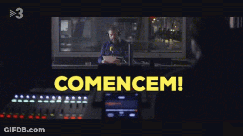 Man At Microphone With Yellow Comencem GIF