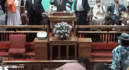 Man At Podium Facing Church Crowd GIF