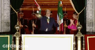 Man At Podium Holding Flag GIF