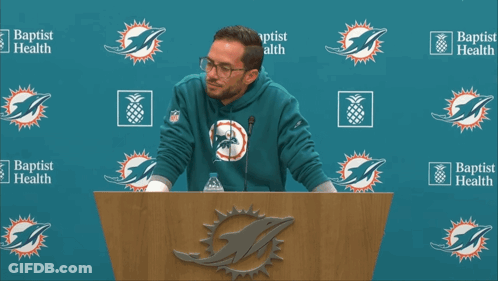 Man At Podium In Front Of Baptist Health GIF