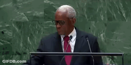 Man At Podium Saying AA GIF