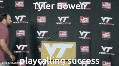 Man At Podium Tyler Bowen Playcalling Success GIF