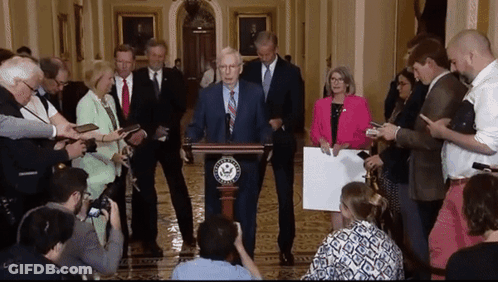 Man At Podium With Congress Sign GIF