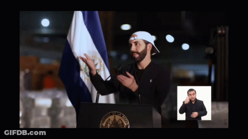 Man At Podium With Flag And Sign Language Sign GIF