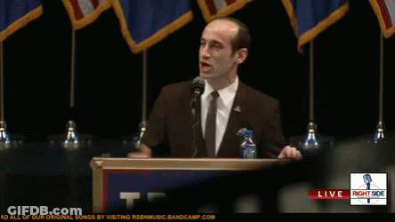 Man At Podium With Right Side Sign GIF