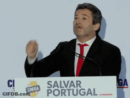 Man At Podium With Salvar Portugal Sign GIF