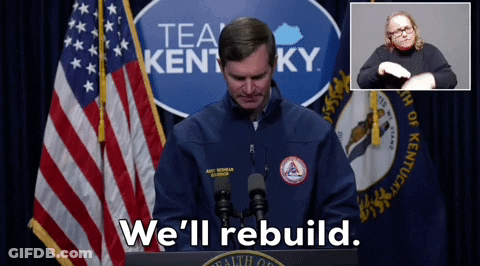 Man At Podium With Sign Saying Tea Kentucky We'll Rebuild GIF