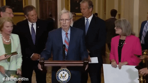 Man At Podium With United States Of America Seal GIF