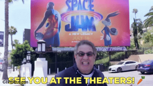 Man At Space Jam Billboard Says See You At Theaters GIF