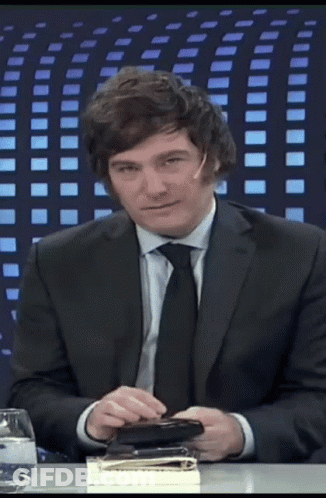 Man At Table In Suit And Tie GIF