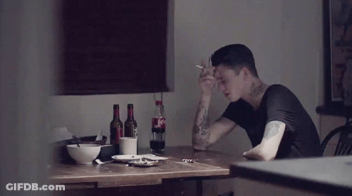 Man At Table With Coca Cola Bottle GIF