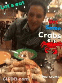 Man At Table With Crabs Saying Let's Eat GIF