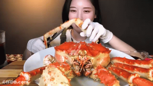 Man At Table With Crabs Saying Let's Eat GIF