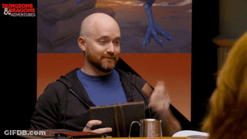 Man At Table With Dungeons & Dragons Screen GIF