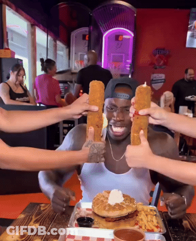Man At Table With Food And Gatorade Sign GIF