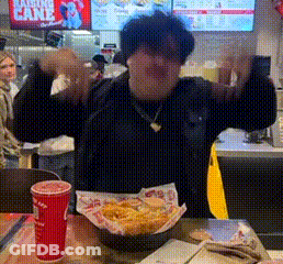 Man At Table With French Fries And Drink GIF