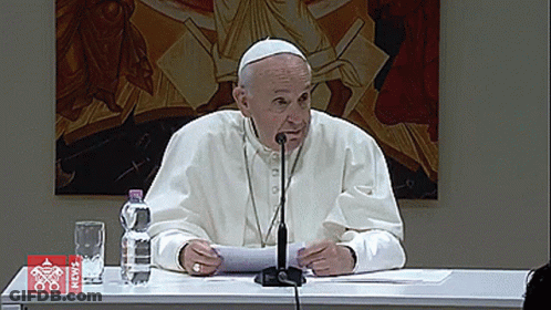 Man At Table With Microphone And News Water Bottle GIF