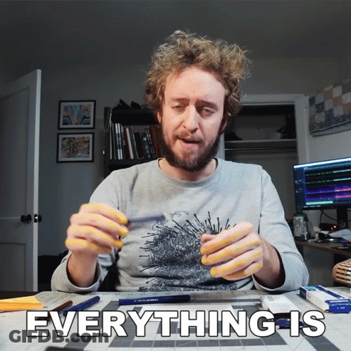 Man At Table With Sign Saying Everything GIF