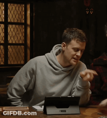 Man At Table With Tablet And Tray Saying Alan GIF