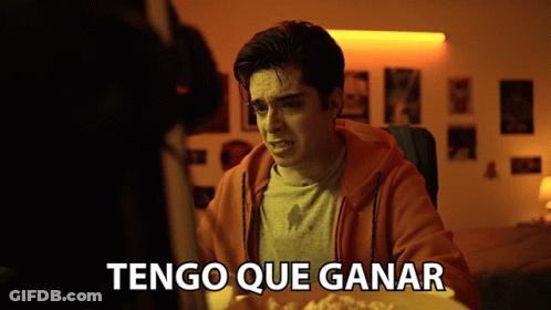 Man At Table With Tengo Que Ganar GIF