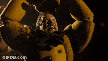 Man Attacked By Yellow Monster In Dark Room GIF