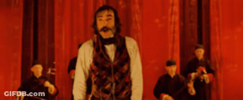 Man Before Red Curtain Saying Whoopie Daisy GIF