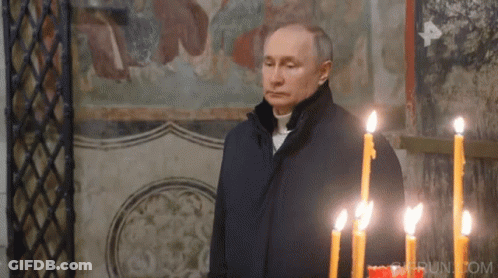 Man Before Row Of Lit Candles With Run.com GIF