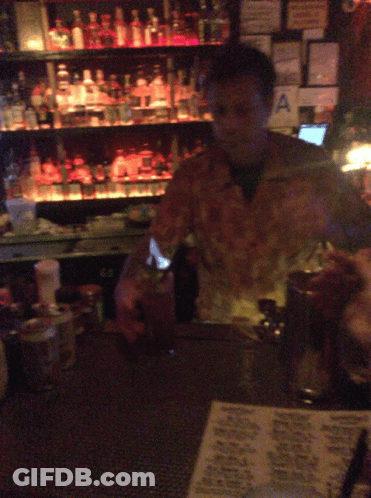 Man Behind Bar With Hawaiian Menu GIF