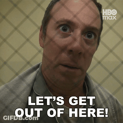 Man Behind Bars Saying Let's Get Out Of Here GIF