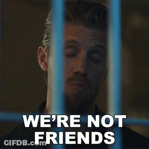 Man Behind Bars Saying We're Not Friends GIF