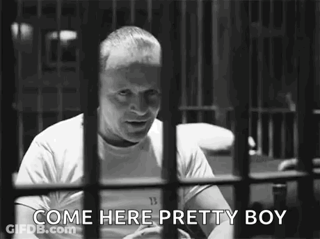 Man Behind Bars Talking GIF