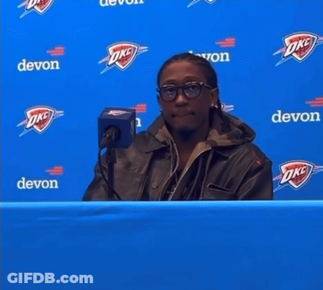 Man Behind Blue Banner Saying Watch The Games GIF