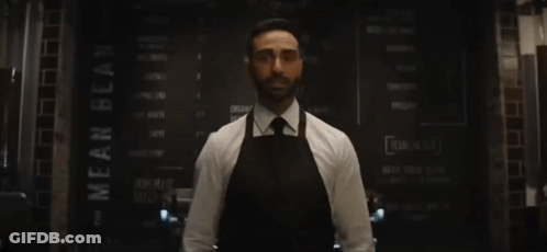 Man Behind Counter Arms Outstretched He's Baaack GIF